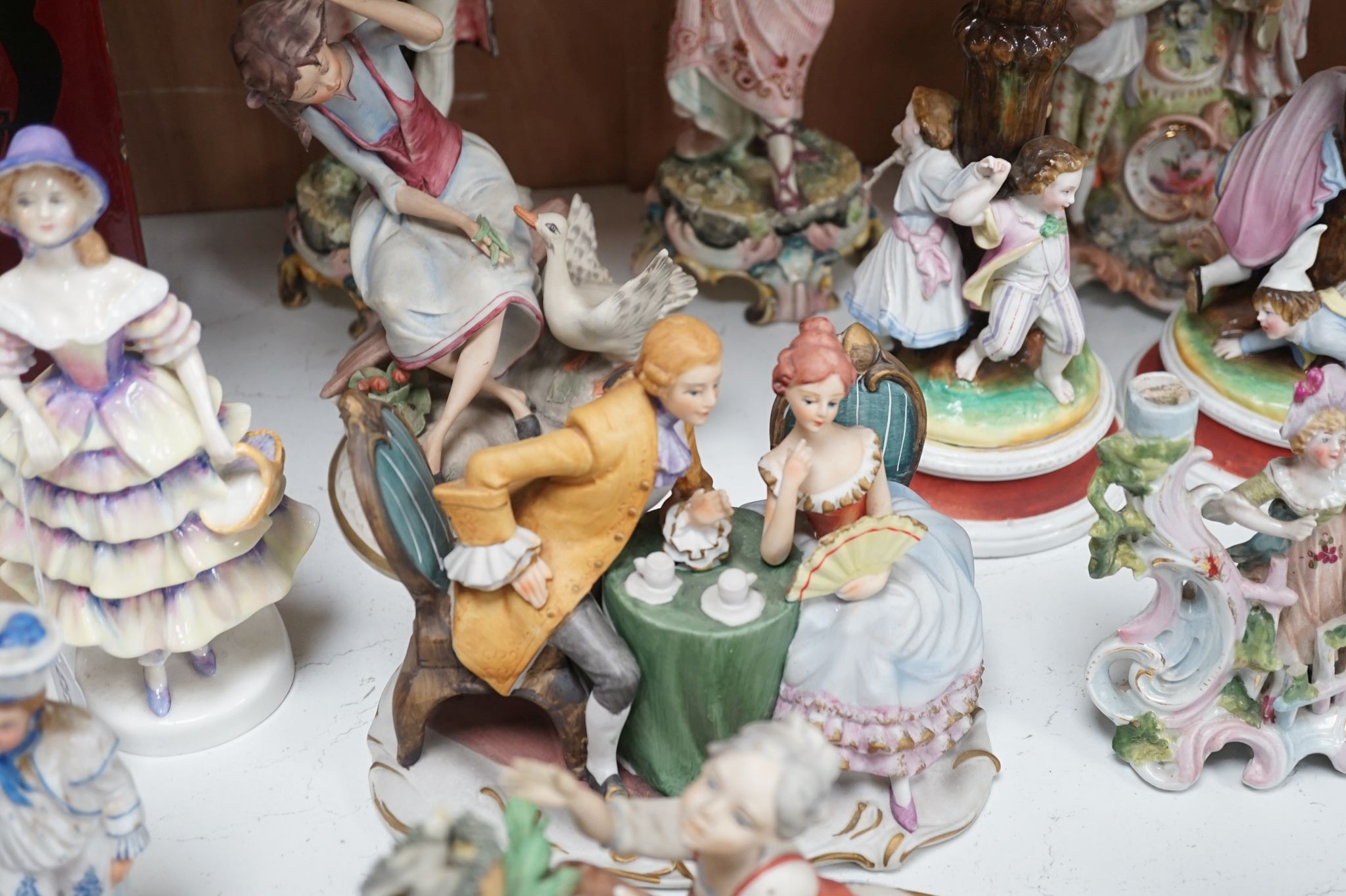 A quantity of various ceramic figures including two Doulton 'Valerie' and 'Meg', tallest figurative candlesticks 34 cms high.